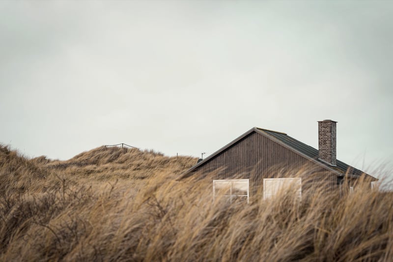 Barn among coastal dunes and grass