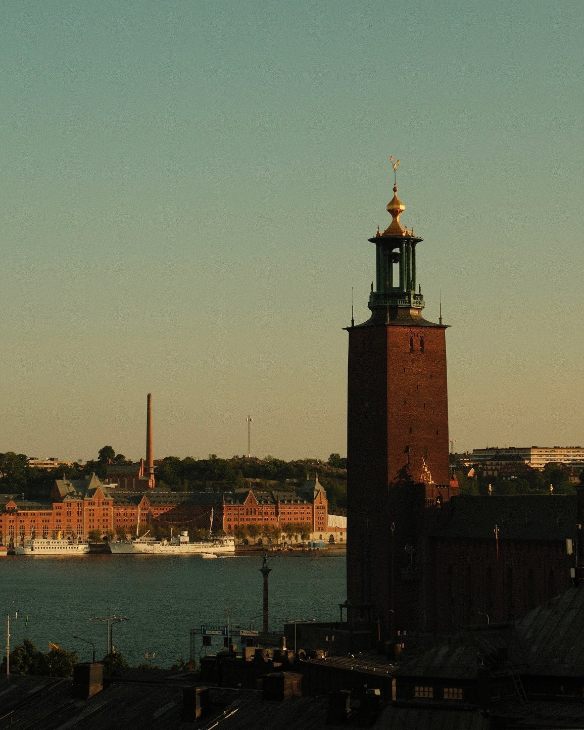Stockholm City Hall tower over the water in evening light