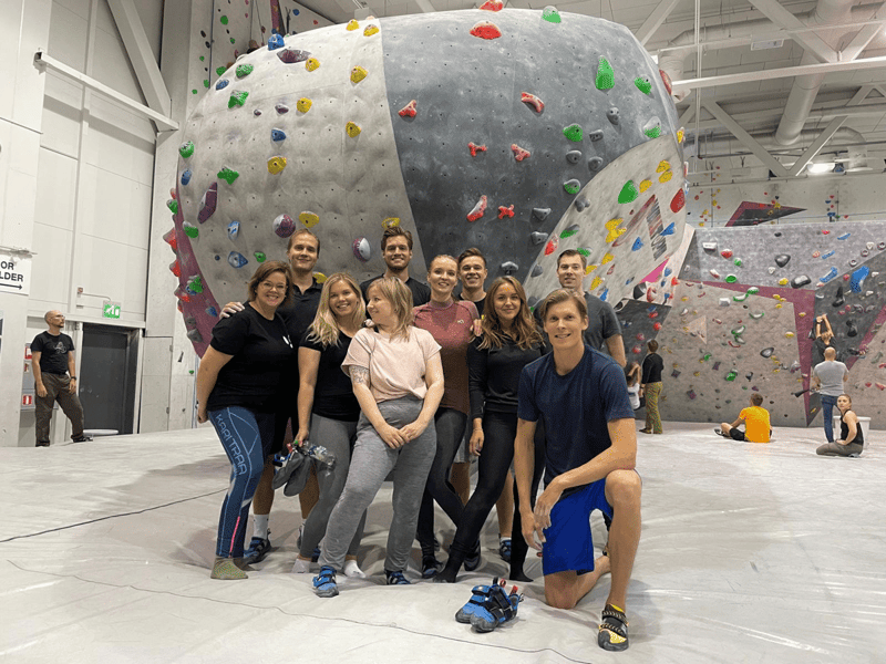 Vainu colleagues together at an indoor climbing gym